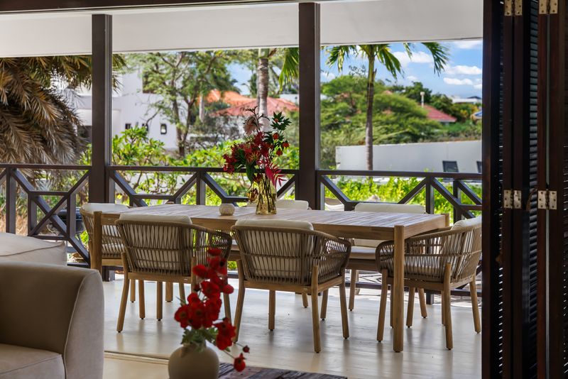 The long dining table on the covered veranda