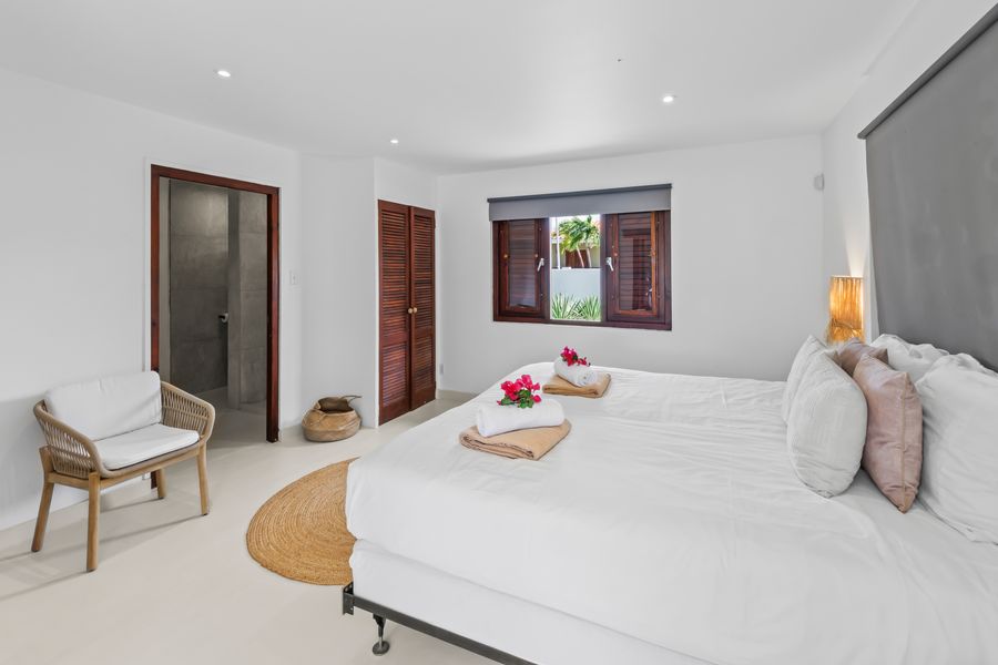 Bedroom with a chair by the window