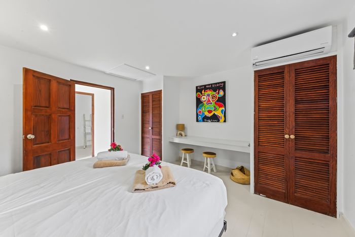 Bedroom with wooden wardrobe doors