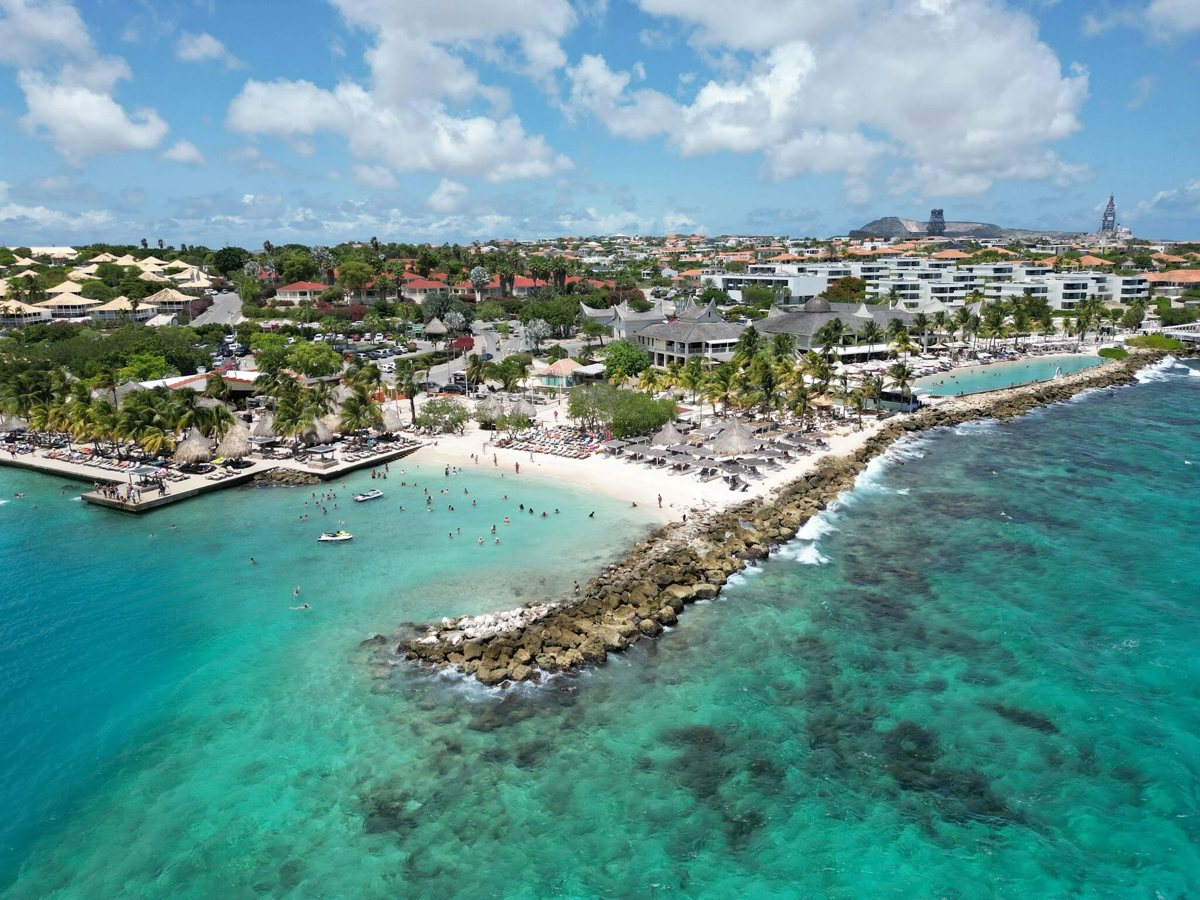 Jan Thiel Beach from above, with the bay and the parasols